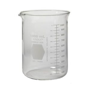 A clear glass beaker with measurement markings filled with liquid.